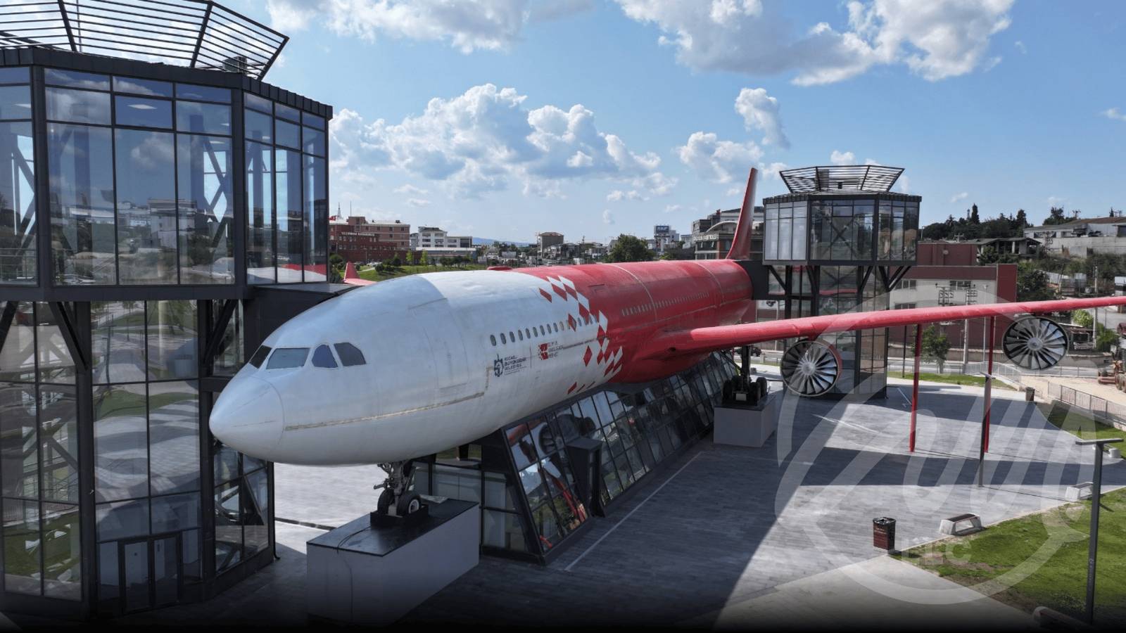 Airplane park science centre with a red and white aircraft exhibit