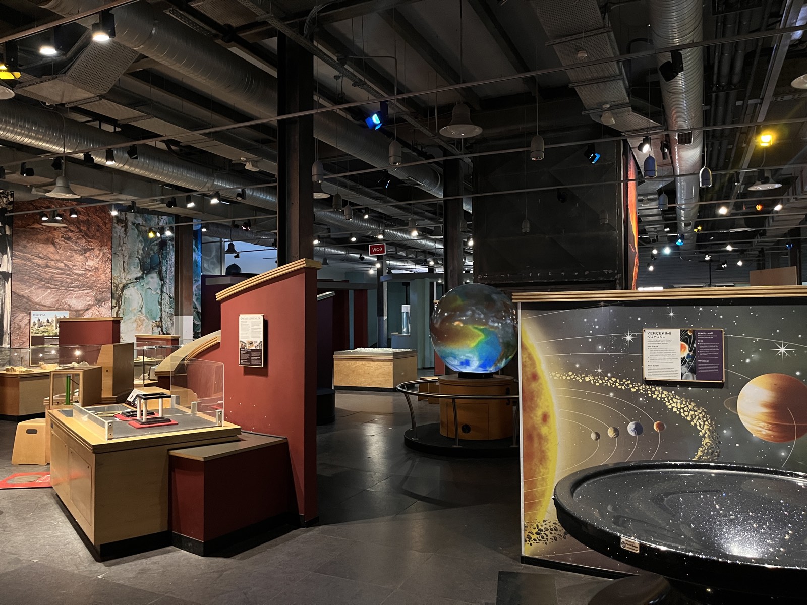 Space and astronomy hall with an Earth globe and gravity-well exhibit
